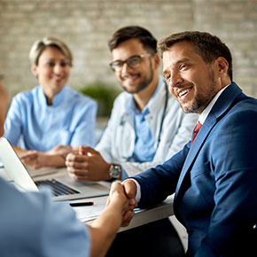 man shaking hands in meeting