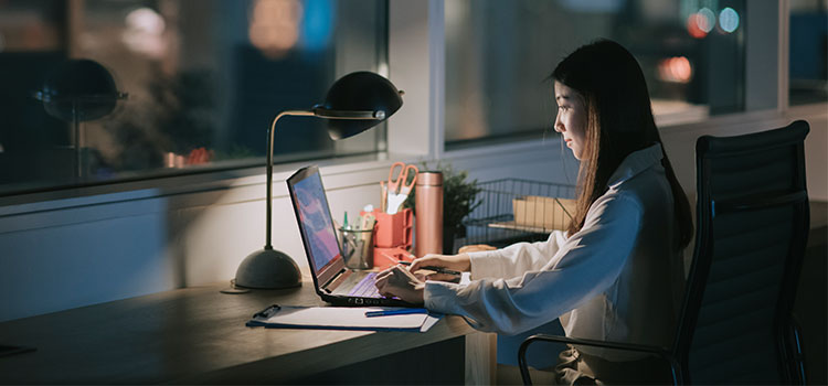 potential hospice nursing student doing research on computer