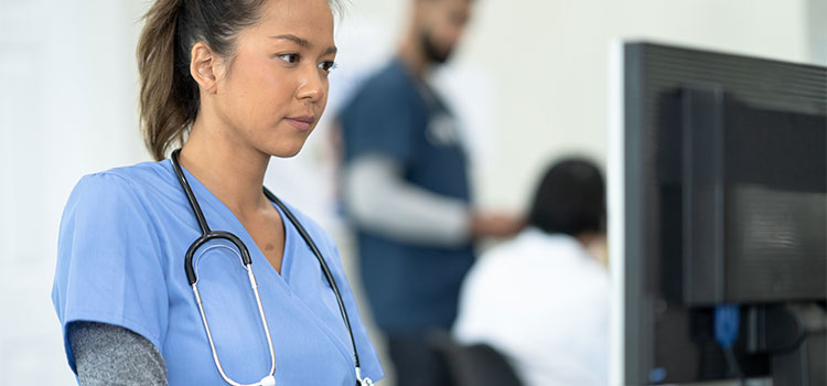 nurse working on computer