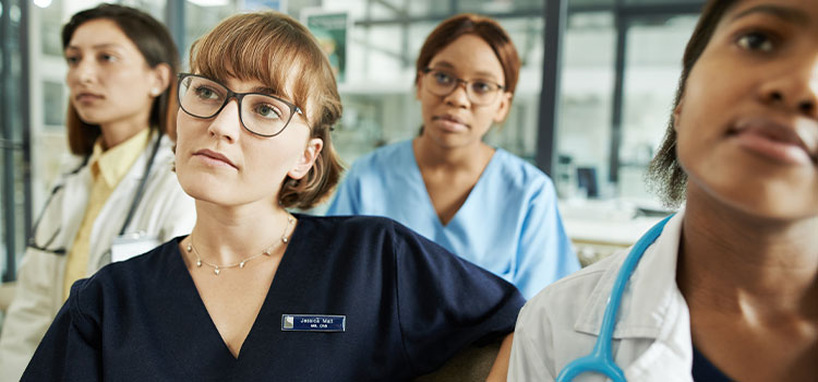 nurses listening to instructor in training class