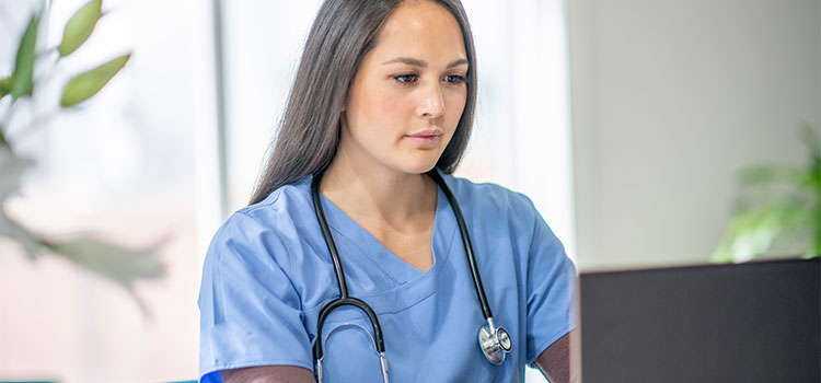 nurse working on computer