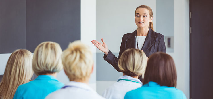 nurse instructor conducting class with nursing students