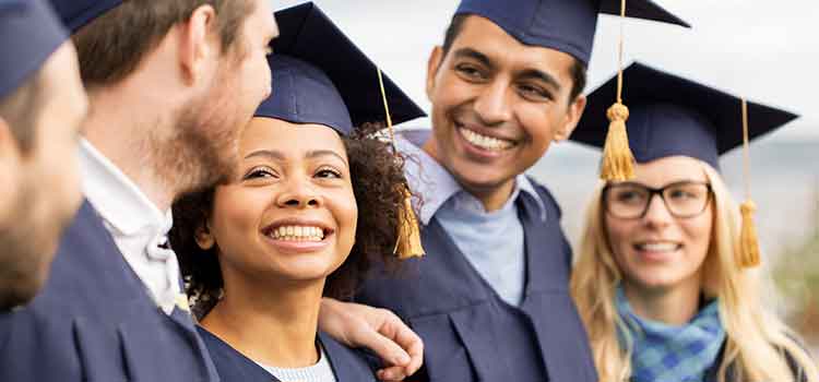 several students in cap and gown at graduation
