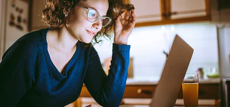 woman looking at laptop