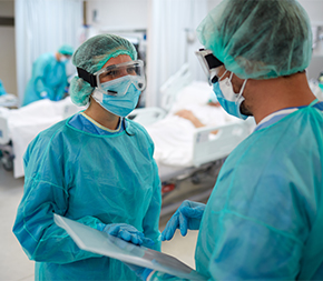nurses talking in an infection control area of hospital