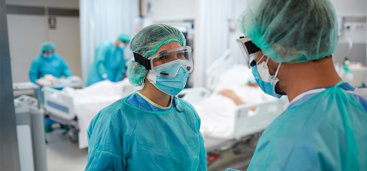 nurses talking in an infection control area of hospital