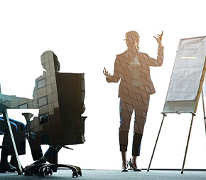 woman stands at easel and gives talk to work team