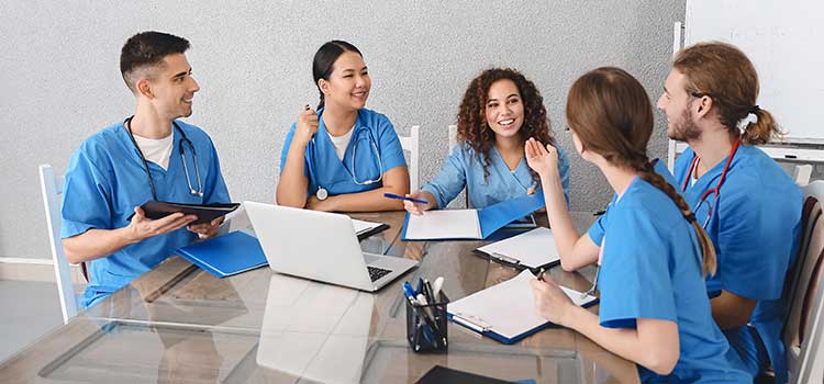 group of nurses socializing and laughing