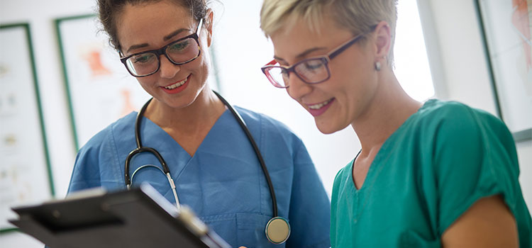 registered nurse and nurse practitioner talking