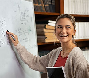 students stand at whiteboard showing math equations