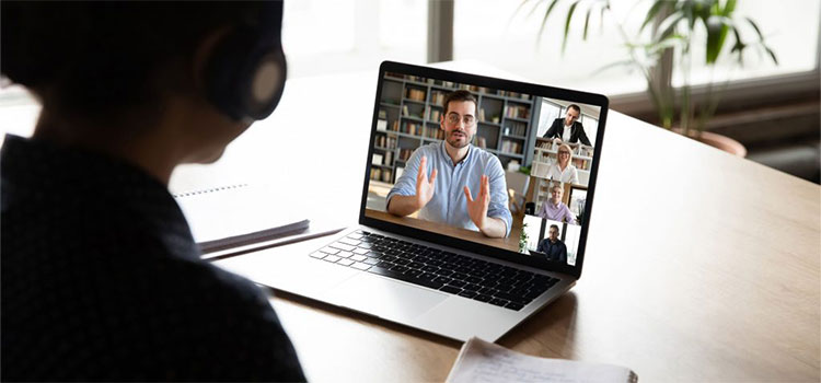 student in online video class with instructor and other students