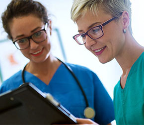 two nurses looking at chart
