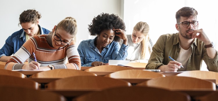five nurses take NCLEX exam in a school