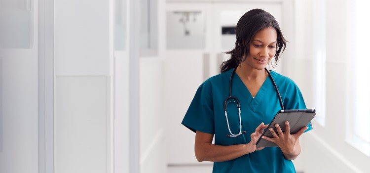 Nurse scrolling on ipad