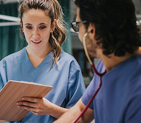 two nurses question patient and record information