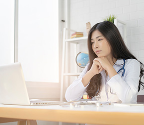 nursing student stares at laptop after failing nclex